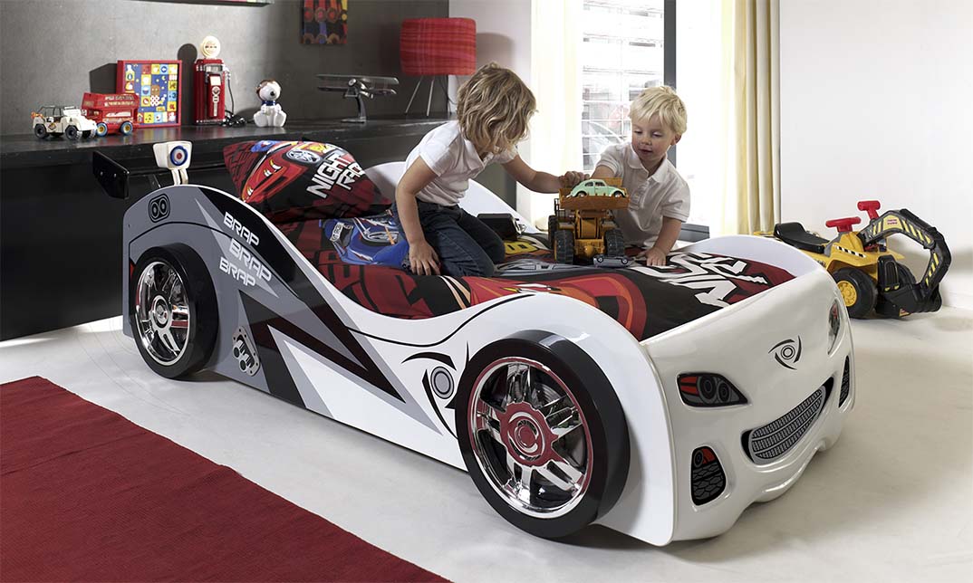 White Brap Brap car bed with grey and red racing graphics, shown with two children